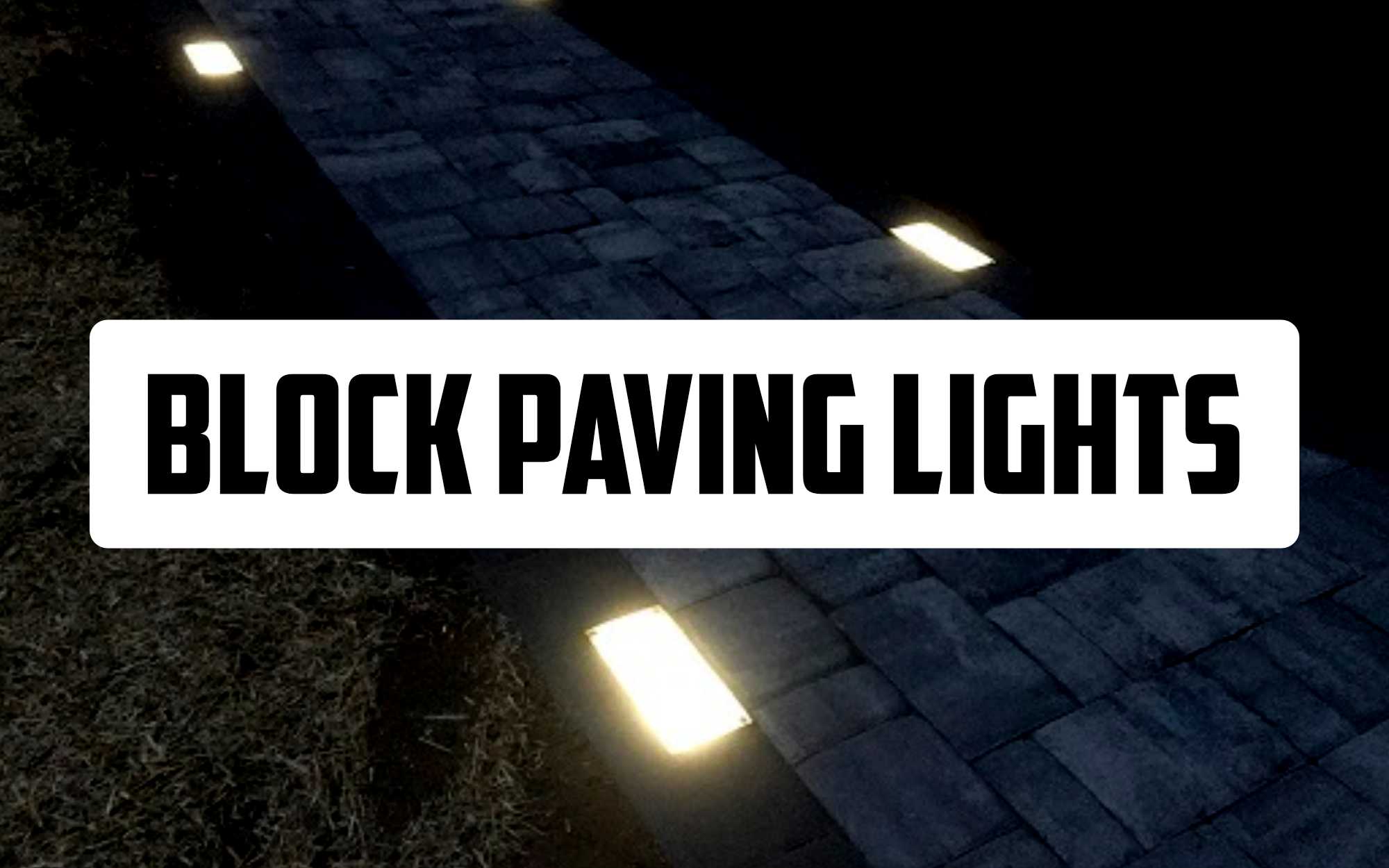 Article photo showing block paving lights illuminated on a driveway