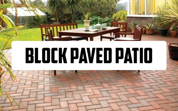 Why You Should Use Block Paving for Your Patio Photo showing a 45 degree herringbone block paving patio with a wooden table